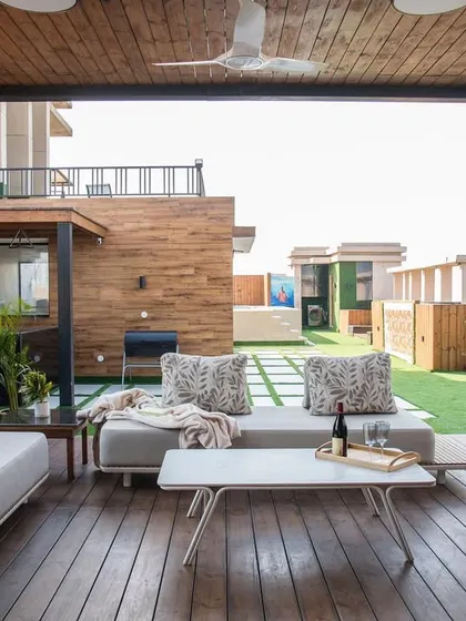 The lounge area under the pergola is designed for comfort. I used durable outdoor fabrics, a ceiling fan for air circulation, and a mix of seating options, including a swing chair, to create a relaxed, resort-like feel.