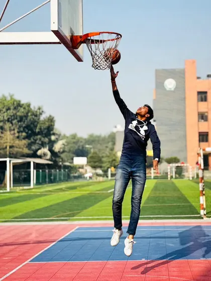 Here I am demonstrating how principles from other sports, like the long jump, can improve your basketball skills. This drill helps build explosive power and body control, essential for driving to the basket and finishing strong.