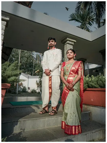 A formal and elegant portrait of the couple in their traditional wedding attire, captured at their outdoor venue.