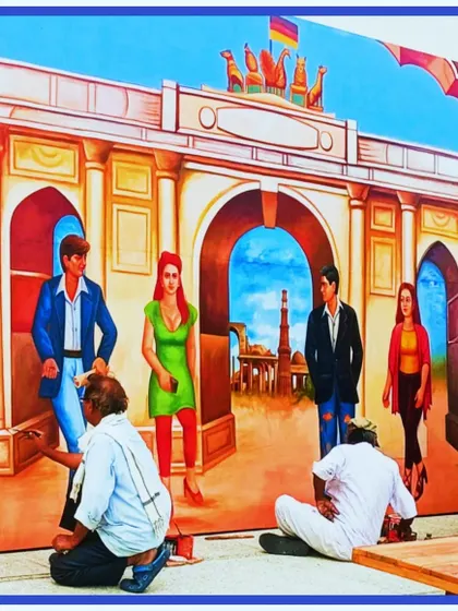 My team and I at work on the large-scale mural for the German Embassy. This was a collaborative effort to create a stunning backdrop.