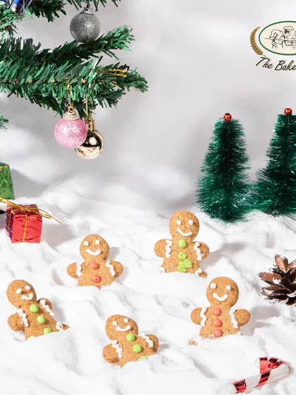 A playful scene with our Gingerbread Cookies in a snowy setting. These cookies are perfect for decorating, gifting, or leaving out for Santa.