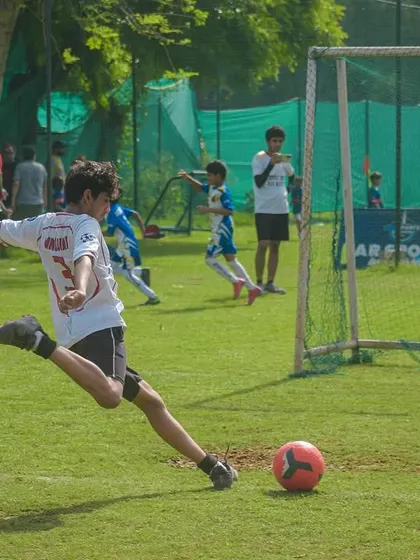 A powerful strike on goal. Witnessing these moments of brilliance is what makes organizing youth football so rewarding.
