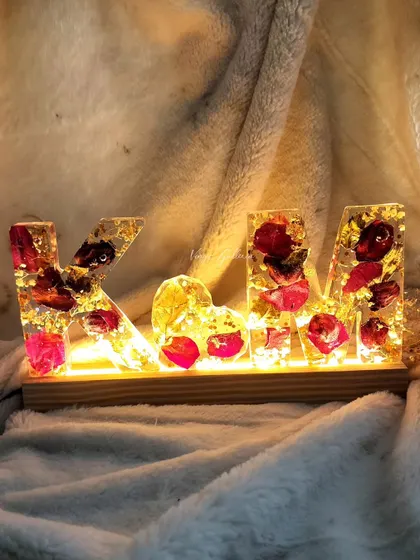 A beautiful monogram lamp and keychain set, preserving a client's special roses with gold leaf accents.