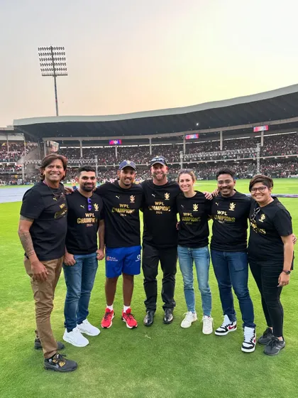 A duplicate of image 64, showing the coaching staff at the RCB Unbox event.