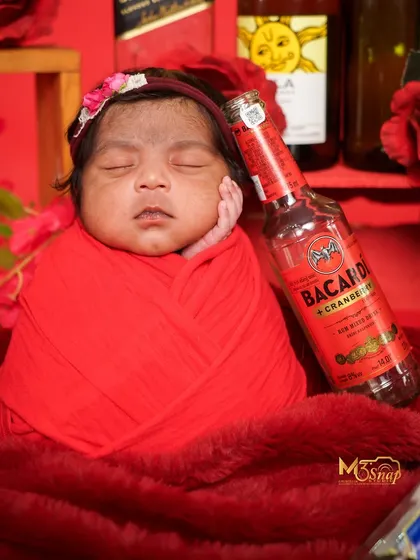 Another variation of the fun "party" theme, this time with a Bacardi prop. These shoots are done with complete safety, using clean, empty bottles.