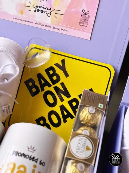 A close-up of the 'Baby on Board' sign included in many of our pregnancy announcement hampers. It's a fun and practical gift for the new parents or grandparents.