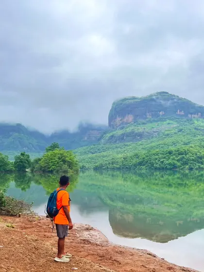 A moment of peace, looking at the reflection of the mountains in the calm waters of a lake in Maharashtra.
