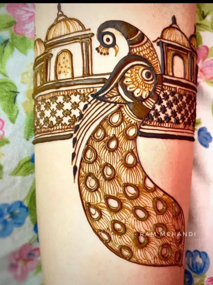 A close-up of a peacock arm band design. I pay close attention to the details in the feathers and the architectural elements to create a rich pattern.
