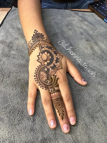 A chic and modern back-of-hand design featuring a lotus motif. This is a perfect choice for someone who wants a stylish and elegant look.