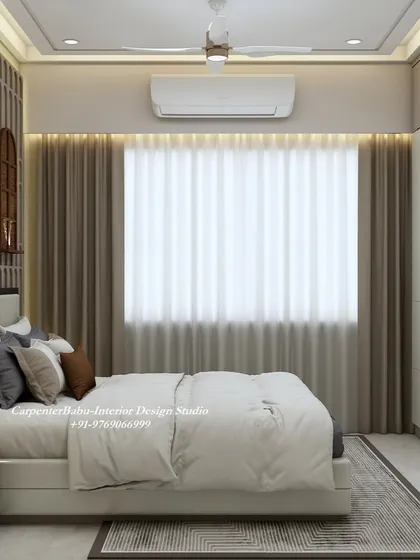 This view shows the clean lines of the full-wall wardrobe and the soft, diffused light from the large window, creating a peaceful and restful atmosphere.