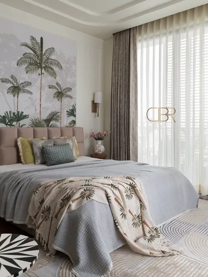 Here is the master bedroom at Casa Zen, a space designed for ultimate relaxation. The tropical-themed wallpaper serves as a serene focal point, complemented by a soft, tufted headboard and natural light that fills the room, creating a peaceful and airy atmosphere.