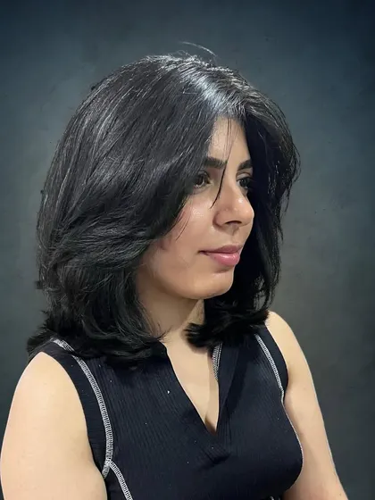 The layers add volume and shape to her hair.