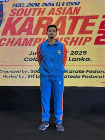 A formal portrait of Jitendra Kumar in his Team India tracksuit at the South Asian Karate Championship. He represents the discipline and pride of our academy.