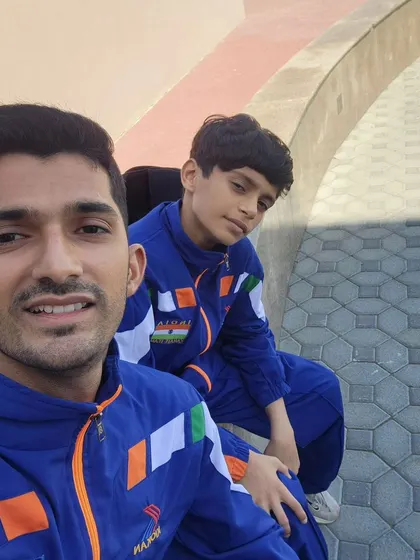 Team Blue, representing India. A selfie with my student Falah, both wearing our team tracksuits at the WKF Youth League. It's a proud moment to be on the international stage.