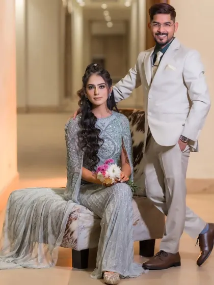 A stylish portrait from an engagement shoot, showing the couple's modern and chic outfits.