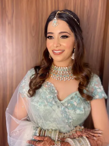 A closer look at Aashna's bridal makeup. I used soft brown eyeshadow and a winged liner to define her eyes, paired with a natural pink lip for a fresh and youthful look.