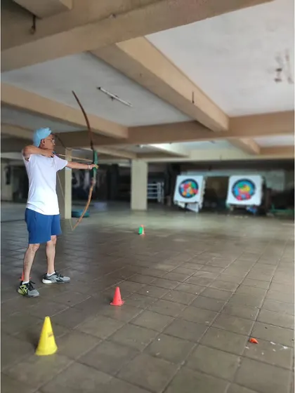 An adult student takes his shot, showing that it's never too late to learn a new skill and find a new passion.