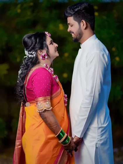 A candid moment of a couple sharing a loving gaze. This photo captures the sweet connection between them during their Haldi ceremony.