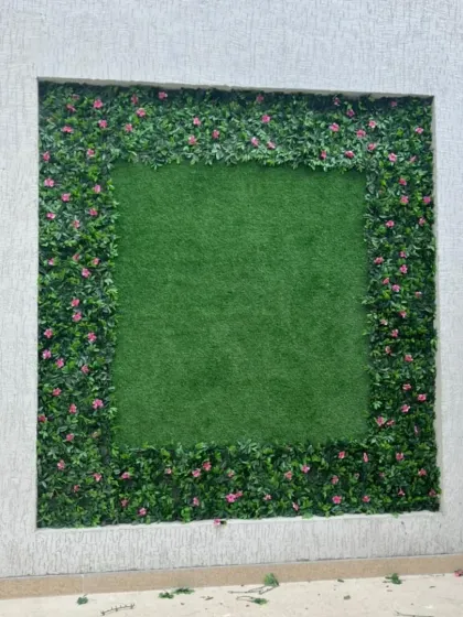 The finished artificial green wall frame. This kind of wall decor is extremely durable and stays looking fresh in all weather conditions, from harsh sun to mountain snow.