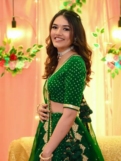 A lovely side profile of Dhruvi. The soft waves in her hair and the simple, glowing makeup create a look of effortless beauty.