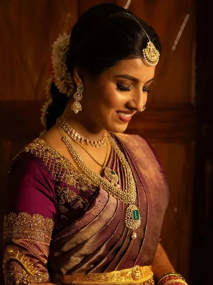 A bride glowing in her custom-designed purple blouse, a memorable piece for her special day.