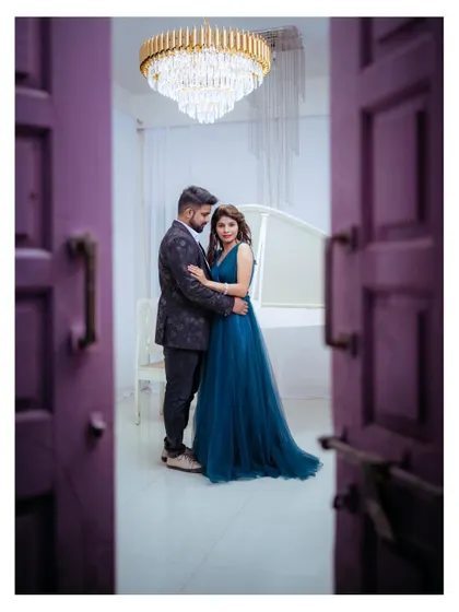 A peek through a doorway into a private, romantic moment. I often use framing techniques like this to add depth and a sense of intimacy to my couple portraits.