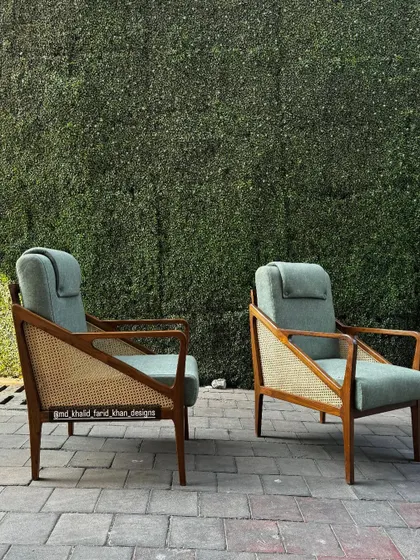 Another view of the high-back chairs, perfect for a reading nook or a quiet corner in a hotel lobby.