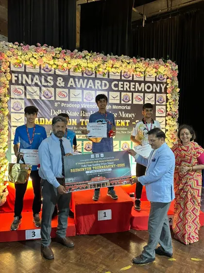 Lakshay receiving his prize at the Delhi State tournament. He secured multiple medals in the Under 15 category, including a gold in mixed doubles.