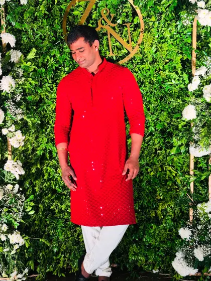 A candid moment captured before the start of a wedding event.