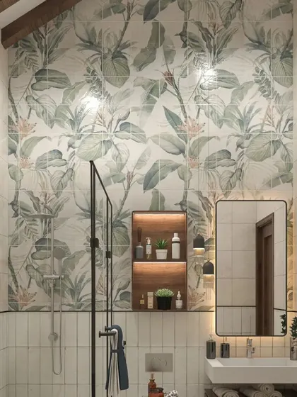 A hotel bathroom design featuring a stunning tropical-print feature wall. The design combines this bold pattern with simple white tiles and a modern vanity to create a look that is both refreshing and luxurious.
