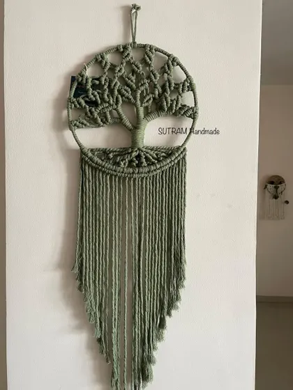 Another look at my olive green Kalpavriksha hanging on a wall. It's made from eco-friendly cotton cord and is a durable, lasting piece of art for your home.