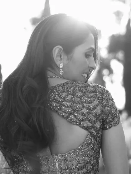 Another artistic black and white shot, focusing on the back and the intricate beading of the custom Versace gown. It’s about creating timeless images.