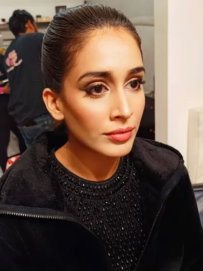 A slightly different angle showing the clean lines of the makeup. This style is perfect for someone who wants a bold, confident look for an evening out.