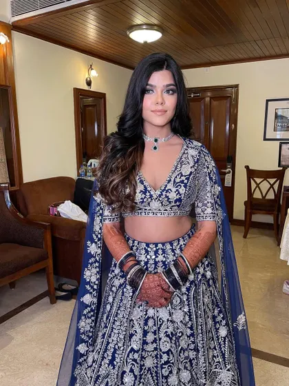 The bride looks beautiful and ready for a night of celebration.