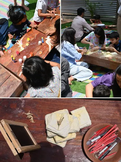 Our little paleontologists at work! These images show children painting wooden dinosaurs and carefully excavating "fossils" from clay tablets during our dinosaur-themed workshop.