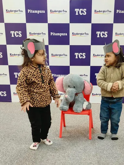 Two little elephants having a chat. Role-playing is a powerful tool for learning, and our theme-based activities provide the perfect platform for it.