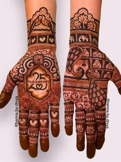This 25th-anniversary mehendi features the number '25' in a decorative frame. The design is filled with hearts, peacocks, and other royal motifs to celebrate the milestone.