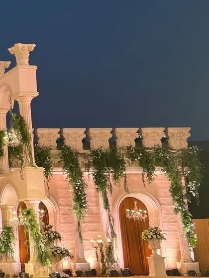 Another angle of the Roman-style structure, emphasizing the clean lines of the pillars and arches against the evening sky.