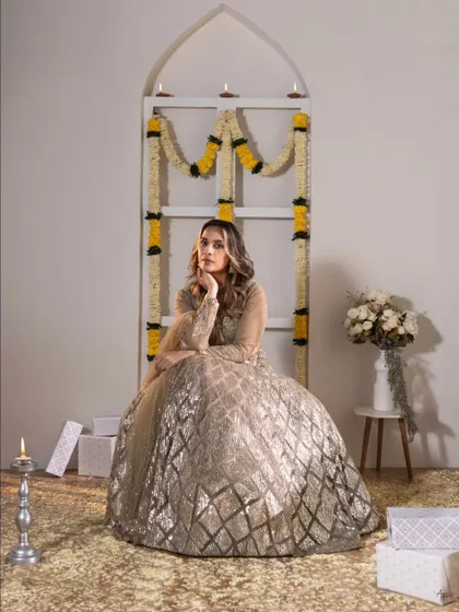 A thoughtful pose amidst the festive setup. This shot showcases the versatility of our studio space, which we can transform to fit any theme, from moody editorials to bright celebrations.