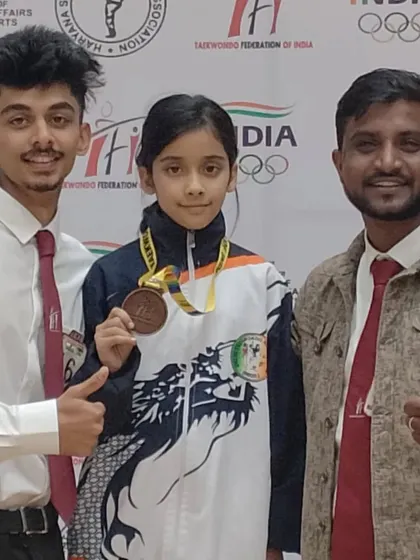 A proud coach with his national medalist. Posing with Naysha after her win at the championship in Panchkula.