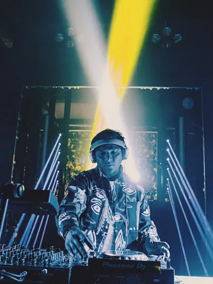 A powerful shot with crossed spotlights, creating a dramatic X effect. The lighting at this gig was perfectly in sync with the music.