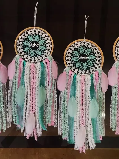 A set of four customized pastel name dreamcatchers. These are a popular choice for return gifts for smaller, more intimate gatherings like birthday parties or baby showers.