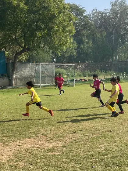 Players in action during a match. Our personalized and age-appropriate programs are designed to unlock each player's full football potential.
