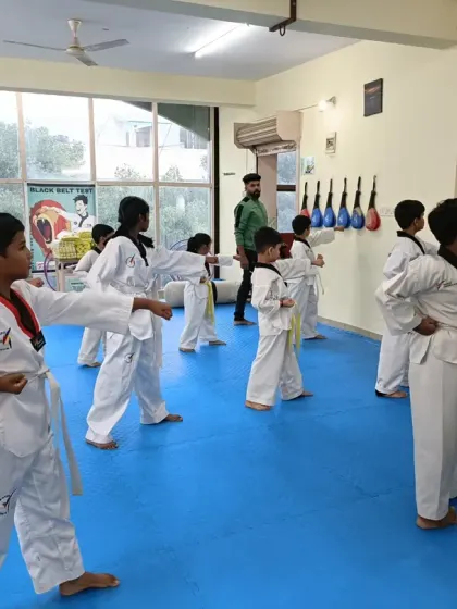 A close-up of students practicing a punch.