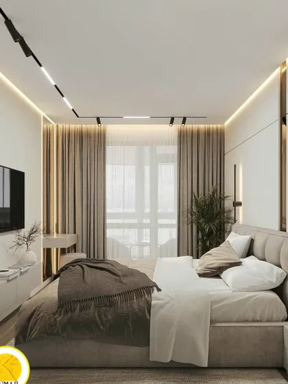 Another wide shot of the bedroom, showing the full effect of the track lighting and the spacious layout.