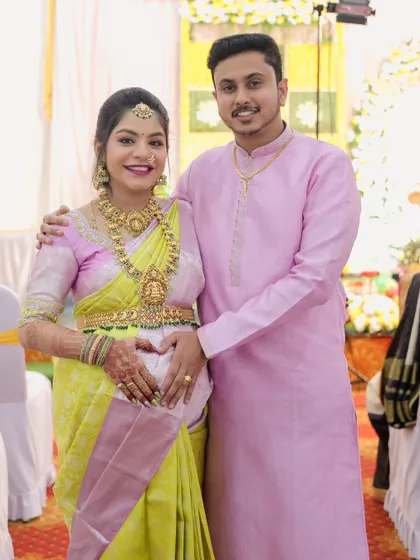 A lovely couple at their baby shower. The mom-to-be is wearing a full temple jewellery set, including a vaddanam, rented from my collection.