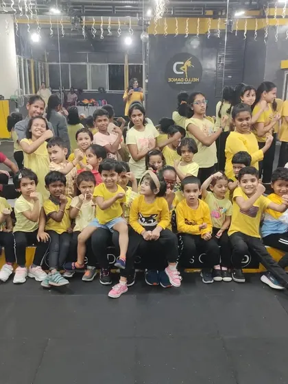 A coordinated pose from our students on yellow day. These activities help build teamwork and a sense of belonging within the group.