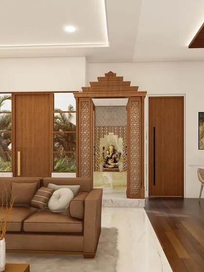 A living room design that beautifully integrates a traditional wooden pooja mandir, showing how sacred spaces can be a central and harmonious part of a modern home.