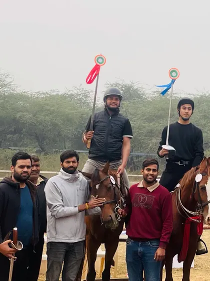 Our victorious riders and their proud supporters after a successful outing at the Junior National Equestrian Championship. The lances and medals are proof of their skill in tent pegging.