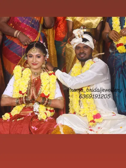 A candid moment from the wedding rituals. The bride's happy and serene expression says it all.
